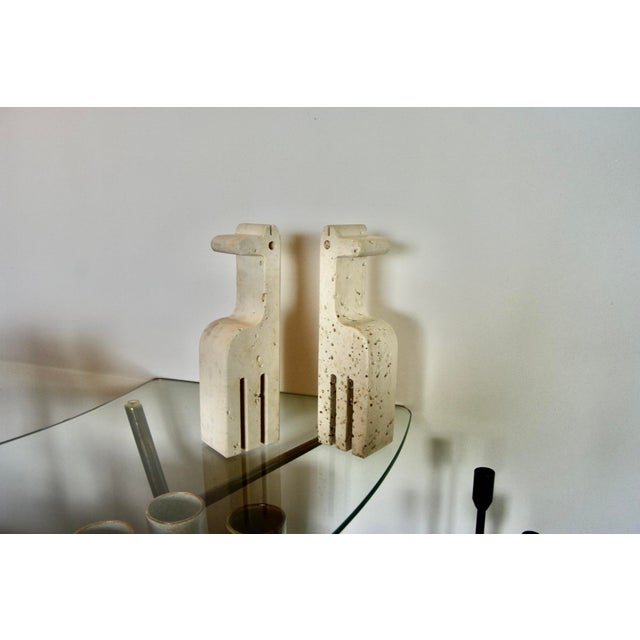 Rare pair of large travertine bookends in the shape of a giraffe, in good condition I have official proof of authenticity...