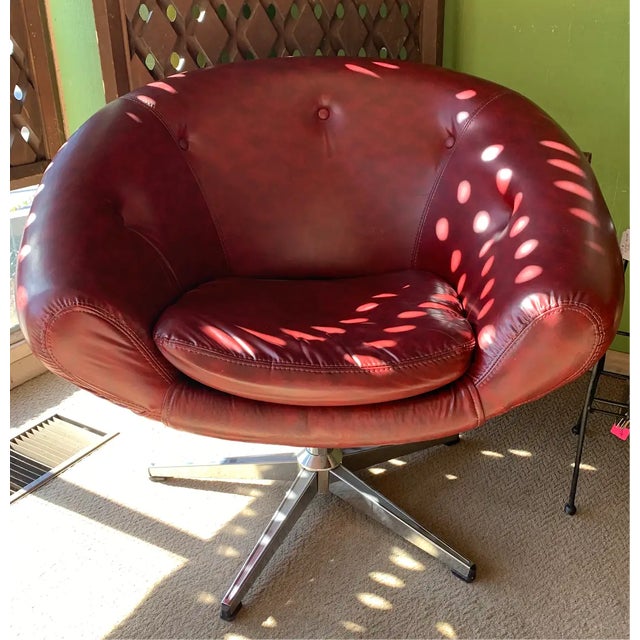 These red vinyl pod chairs were designed by the world-renown Swedish design firm Overman International. Importantly, they...