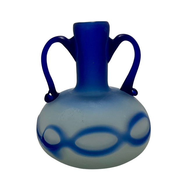 A hand-blown glass amphora-style vase. Displaying the striking and iconic "Phoenician style," this beautiful folk art...