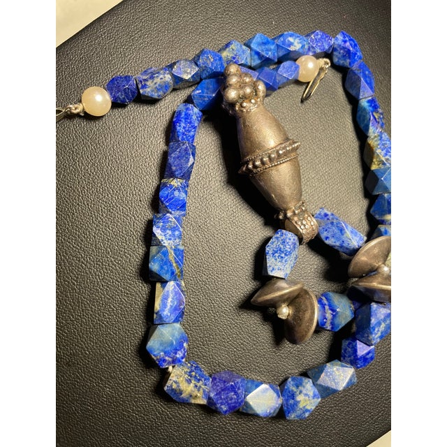 The primary deep blue material is Lapis Lazuli, which is a rock composed of several minerals, most notably lazurite (which...