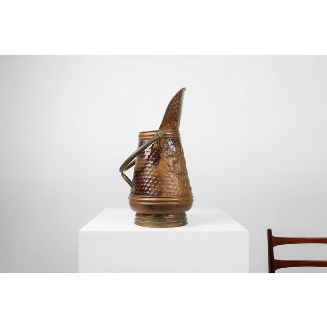 A richly detailed French copper coal bucket, crafted around 1900, now serving beautifully as a decorative umbrella stand....