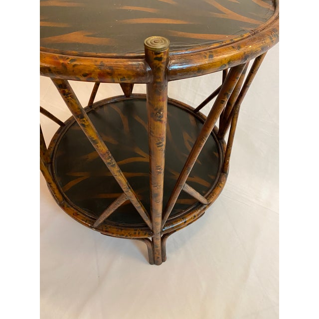 Maitland-Smith Burnt Bamboo Two-Tier Side Table with Hand-Decorated Lacquer Tops and Brass Accents A highly decorative...