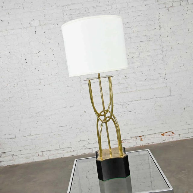 Beautiful brass looped tube table lamp with painted wood base, and newer style white drum shade. Lovely condition, keeping...