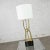 Beautiful brass looped tube table lamp with painted wood base, and newer style white drum shade. Lovely condition, keeping...