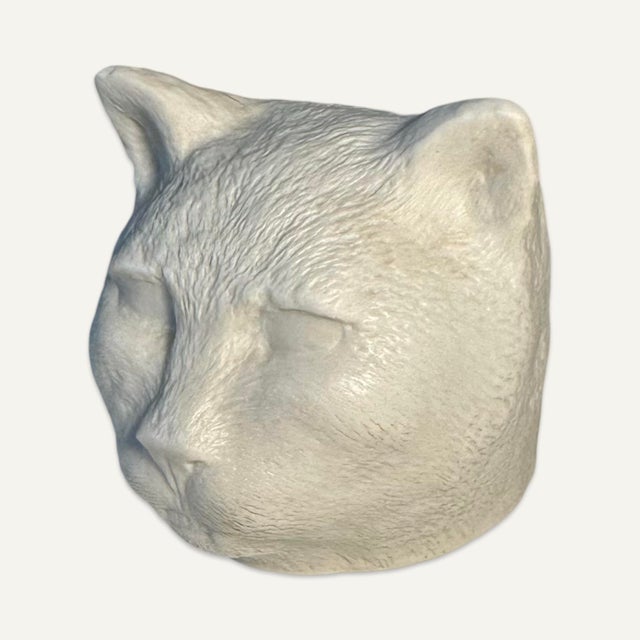Kiki Smith (b 1954,) Cat 1999, high fired porcelain with glazed interior, stamped “KS 1999 AD 67/150.” This sculpture is...