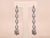 The Daenerys Antique Platinum and Diamond Dangler Earrings. The earrings are set with 2.60 carats of old cut diamonds...