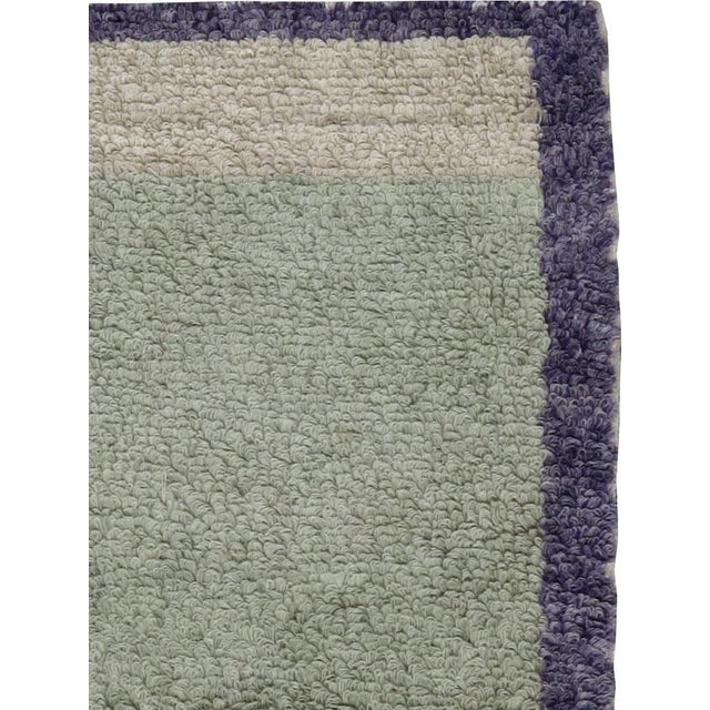 A vintage Turkish Konia carpet with mint and purple hues from the mid-20th century.