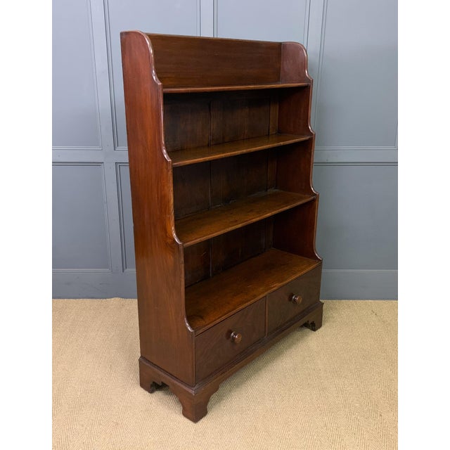 A very good Victorian period mahogany waterfall open bookcase. Of very good construction and of generous proportions....