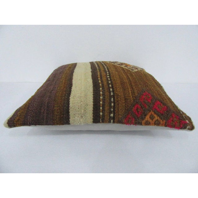 Handmade decorative pillow cover made from a vintage Turkish kilim rug. Backed with good quality cotton fabric. Pillow...