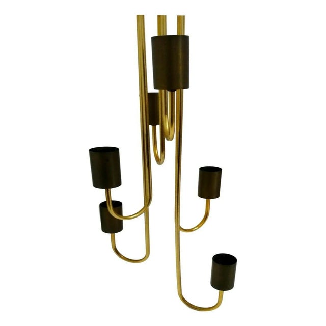 Six-light chandelier, production Goffredo Reggiani of the 70s. Entirely made of brass, with six curved shaped arms and...