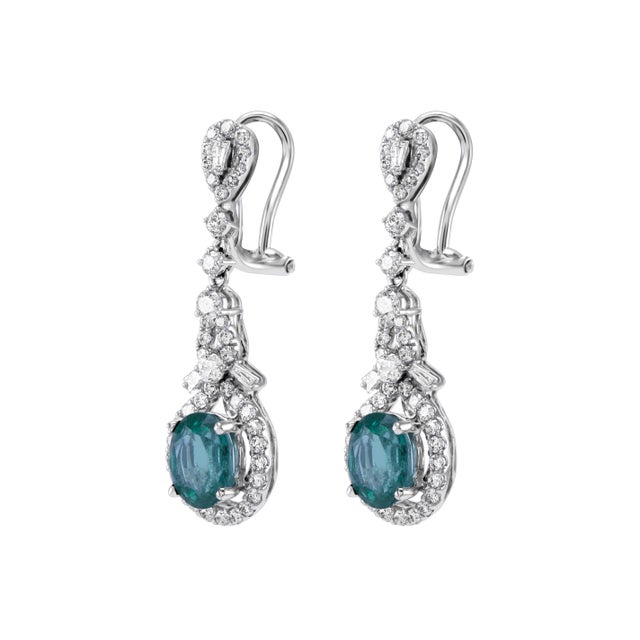 Beautiful natural oval emerald and diamonds drop earrings. 3.43 carats total gemstone weight. 2 oval emeralds, 2.15...