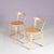 1950s set of 2 chairs model 68 designed by Alvar Aalto. Crafted in pine wood, these chairs embody Aalto’s signature...