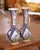 Crafted in Quimper, France circa 1880, this elegant pair of antique faience vases showcases the refined artistry of HB...