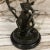 Vintage sculptural bronze Palm Beach antique market find, handmade monkey figurine with two palm trees candelabra.