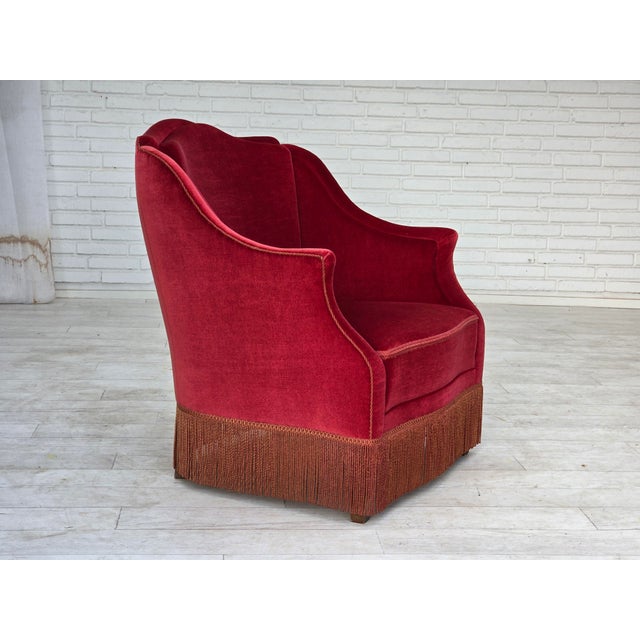 1970s, Danish armchair. Original red furniture velour, ash wood legs, springs in the seat. Original very good condition:...