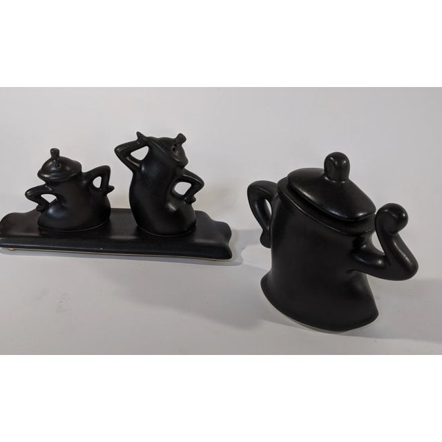 Salt and Pepper Shaker with tray & Sugar container in excellent condition. These were made in the 1970s by artist Michael...