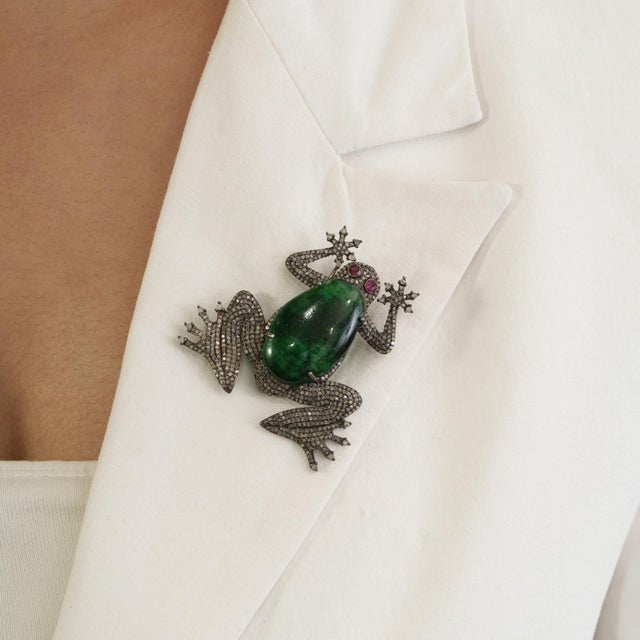 The Vintage-Style Hollywood Regency Emerald, Ruby & Diamond Frog Brooch Pendant is crafted in 925 sterling silver and...