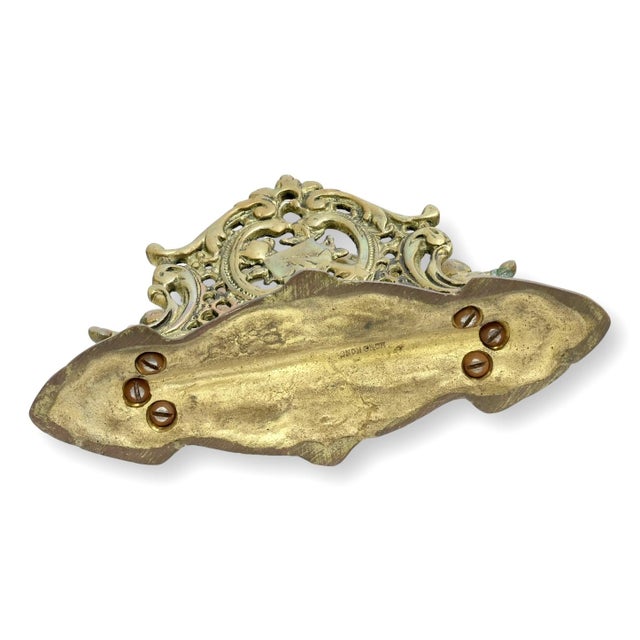 Mid 20th century brass filigree letter rack inspired by Victorian designs and marked Hong Kong, circa 1950. Featuring...