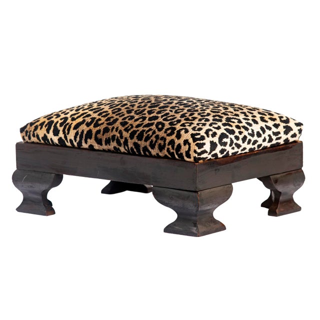 Antique mahogany empire period footstool featuring distinctive scrolled legs. The velvet fabric is a long-standing iconic...