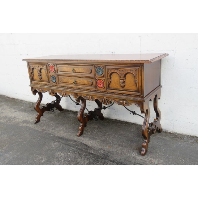 This wonderful Sideboard/Buffet is made out of wood, solid wood, and veneer. The Sideboard is labeled Berkey and Gay, it...