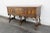 This wonderful Sideboard/Buffet is made out of wood, solid wood, and veneer. The Sideboard is labeled Berkey and Gay, it...