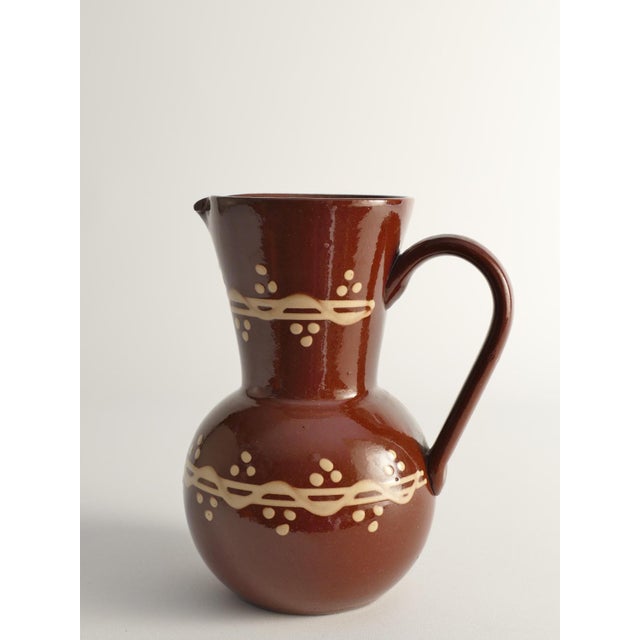This rare Swedish folk art earthenware pitcher or vase, crafted by Andersson & Johansson for Höganäs in Sweden, features a...