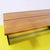 Vintage desk featuring a wooden top and black lacquered sides.