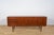 Sideboard made in the 1960s in Denmark. Sideboard consists of three sliding doors and five drawers, inside there are...