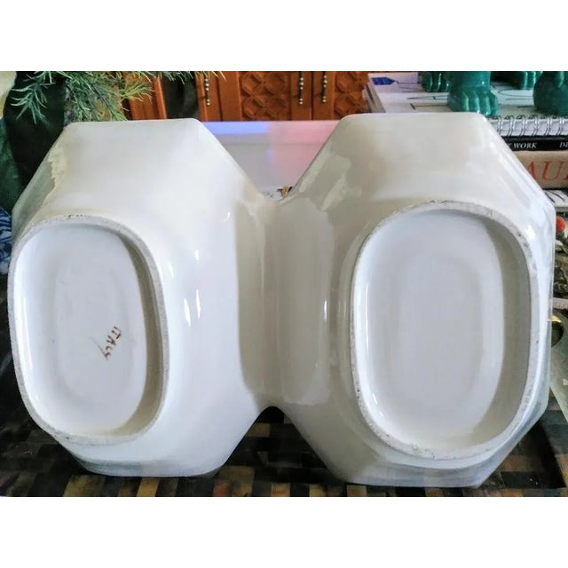 A beautiful double bowl server made in Italy. The bowl has beautiful faux bamboo details with a floral design on the...