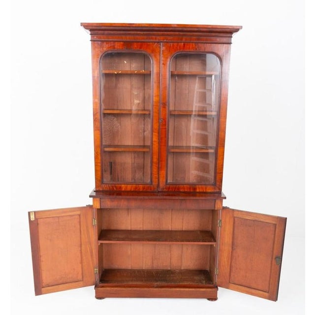 Impressive Victorian library bookcase crafted from richly figured mahogany Standing on a substantial plinth base with...