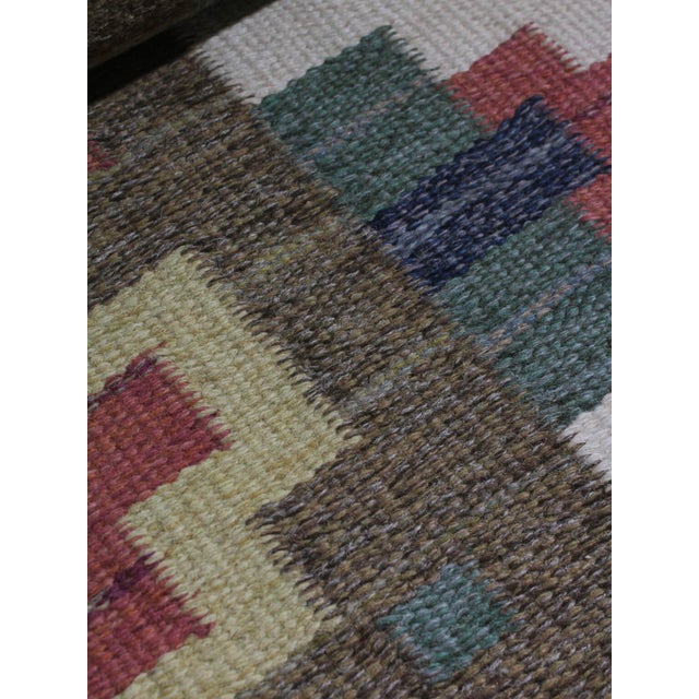 Mid-Century Swedish Wool Kilim Rug by Greta Kruse, 1960s, in Good conditions. Designed 1960 to 1969 This piece has an...