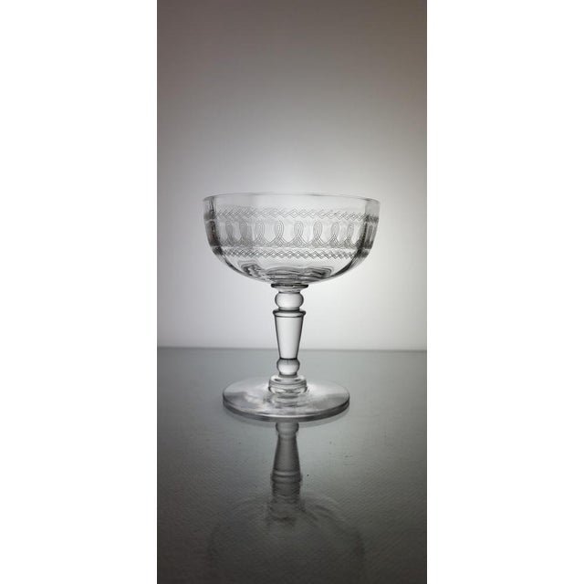 Set of 7 engraved crystal champagne glasses / Early XXth / Baluster leg with 1 knob / ribbed bowl Beautiful brilliance and...