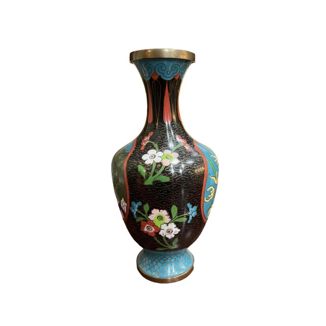 A Antique Chinese vase with amazing multicolored enamel depicting water, floral designs, mountains, trees, and a figure...