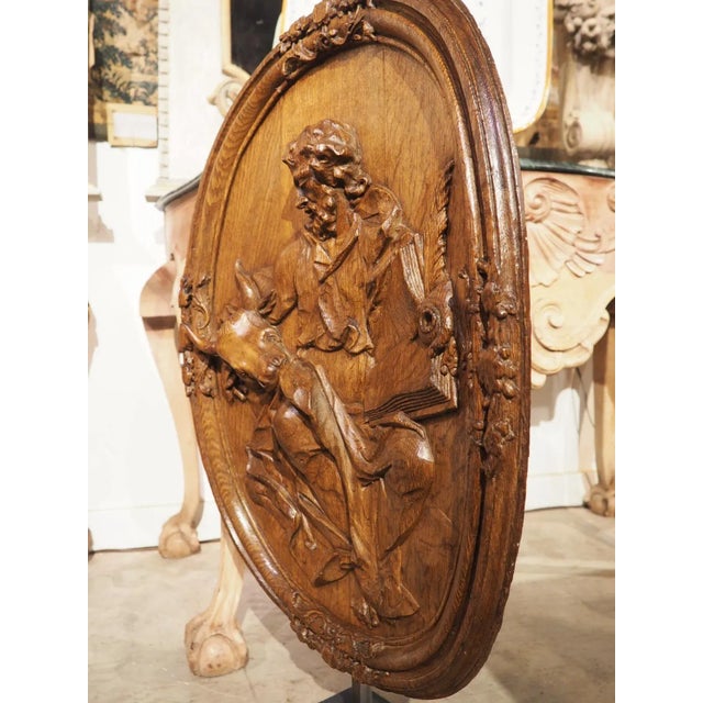 A magnificent display of mastery level woodworking, this antique oval plaque of St Luke was not only carved in bas relief,...
