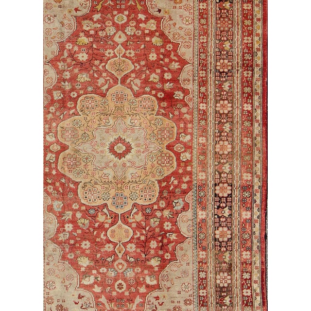 Measures: 6'2 x 9'10. Antique Oushak Rug With Medallion in Soft Red, Brown and Tan 6'2" x 9'10" Floral Medallion Turkish...