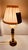 Small solid brass candlestick lamp with new cream color pleated clip on lamp shade. 12" tall to top of shade, 2.5" wide....