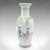 This is a vintage flower vase. A Chinese, ceramic decorative urn with figural decor, dating to the mid 20th century, circa...