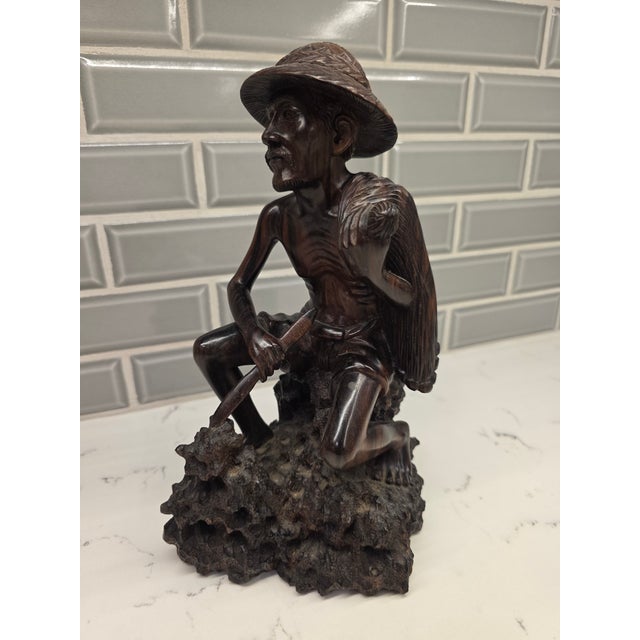 An extraordinary, gallery-tier mid-century Balinese expressionist realism carving depicting an old fisherman. Hand-carved...