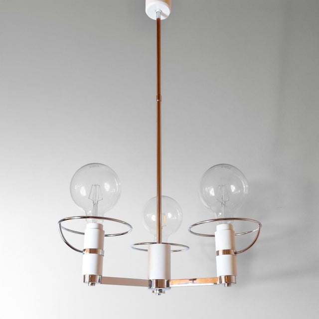 Space Age Three-Light Chromed Chandelier, Italy, 1970s. Unsual chandelier manufacture in Italy that blends the elegance of...