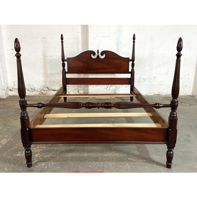 This full size mahogany four poster bed frame by Dixie features tall carved posts with reeded detailing, turned accents,...