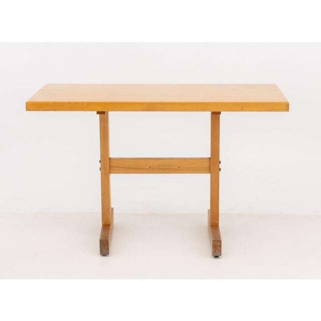 Modern Blond Oak Wood Dining Table, the rectangular top above two supports. 30" H x 48" W x 27" D. Provenance: From an...