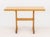 Modern Blond Oak Wood Dining Table, the rectangular top above two supports. 30" H x 48" W x 27" D. Provenance: From an...