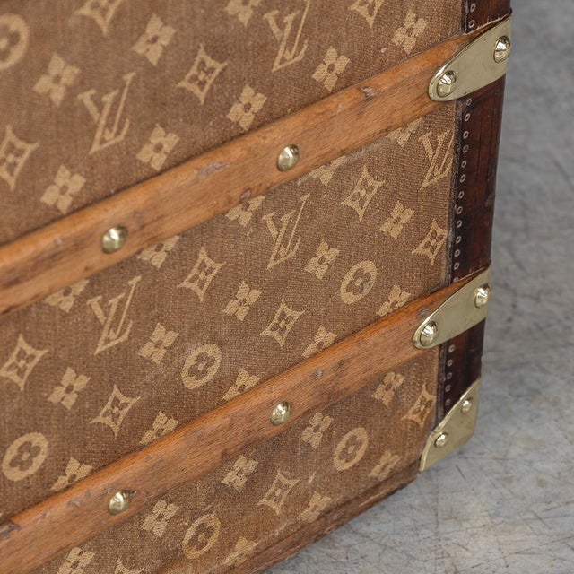 This exceptional louis vuitton courier trunk, crafted in france circa 1896, is adorned with the very first woven monogram...