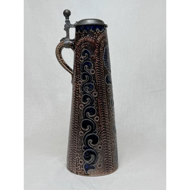Hark back in time with this original German pitcher stein by Reinh Merkebach, renown pottery make in Germany. Rustic...