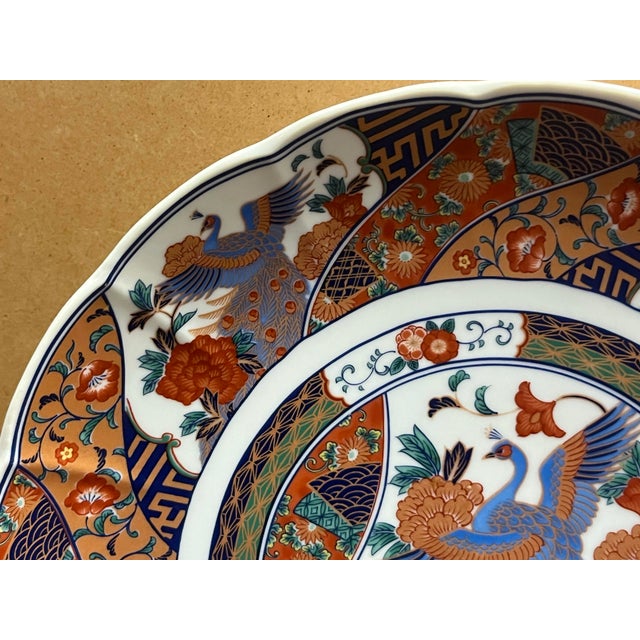 A beautifully decorated vintage Japanese Imari-style porcelain charger produced for Andrea by Sadek and made in Japan....