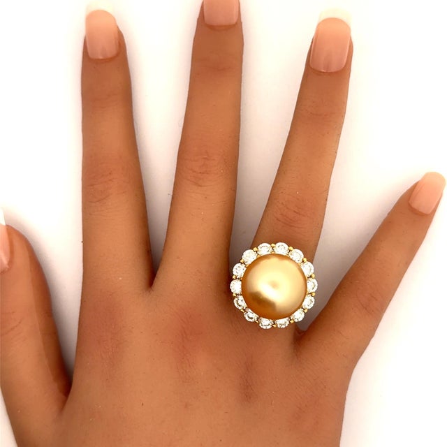 A striking South Sea Pearl, measuring an astonishing 17 millimeters, is the focal point of this exquisite ring. The...