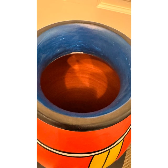 Striking large 17" pottery vase featuring a vibrant hand painted abstract design in rich red, yellow, teal, black and...