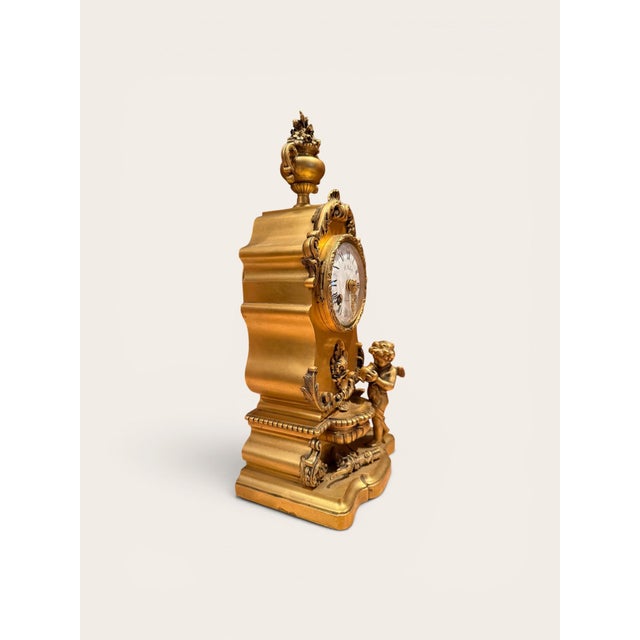 A fine 19th-century French mantel clock crafted in bronze doré and signed G. Fabre, Paris on the enamel dial. The richly...