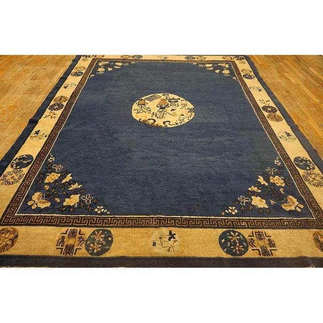 Hand Knotted Pile 1920s Antique Wool Blue Rectangle Floral Medallion Rug, Circa Date: 1920s. This exceptional piece...