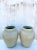 Vintage Contemporary pair of urns. Beautiful matte glazed finish in a pale green color. Drilled for draining. Part of a...